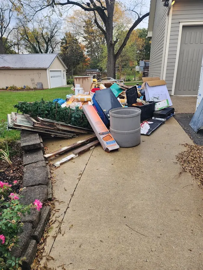 Dumpster being loaded with debris for Roofing Dumpster Rental in Alamo